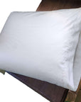 Organic cotton pillowcase on bed, GOTS certified, made in USA by Happy Hands.