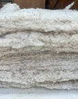 Stack of 100% cotton batting, eco-friendly and hypoallergenic.