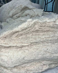 100% cotton batting, eco-friendly, hypoallergenic, versatile material for bedding and quilting.