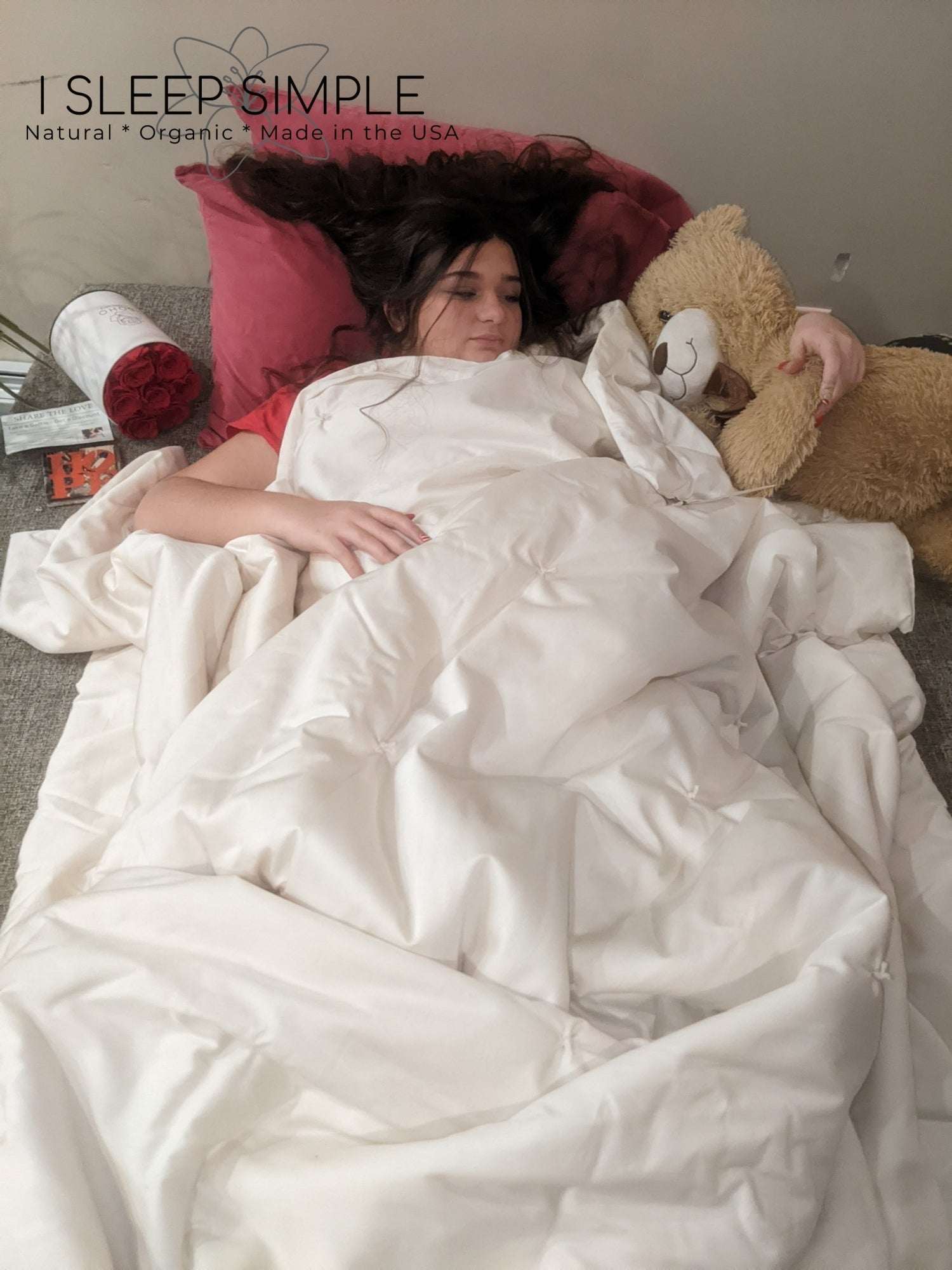Person cozy under a washable wool duvet, showcasing comfort and quality.