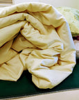 Handmade wool duvet, eco-friendly bedding made from New Zealand wool, USA-crafted for luxury sleep.
