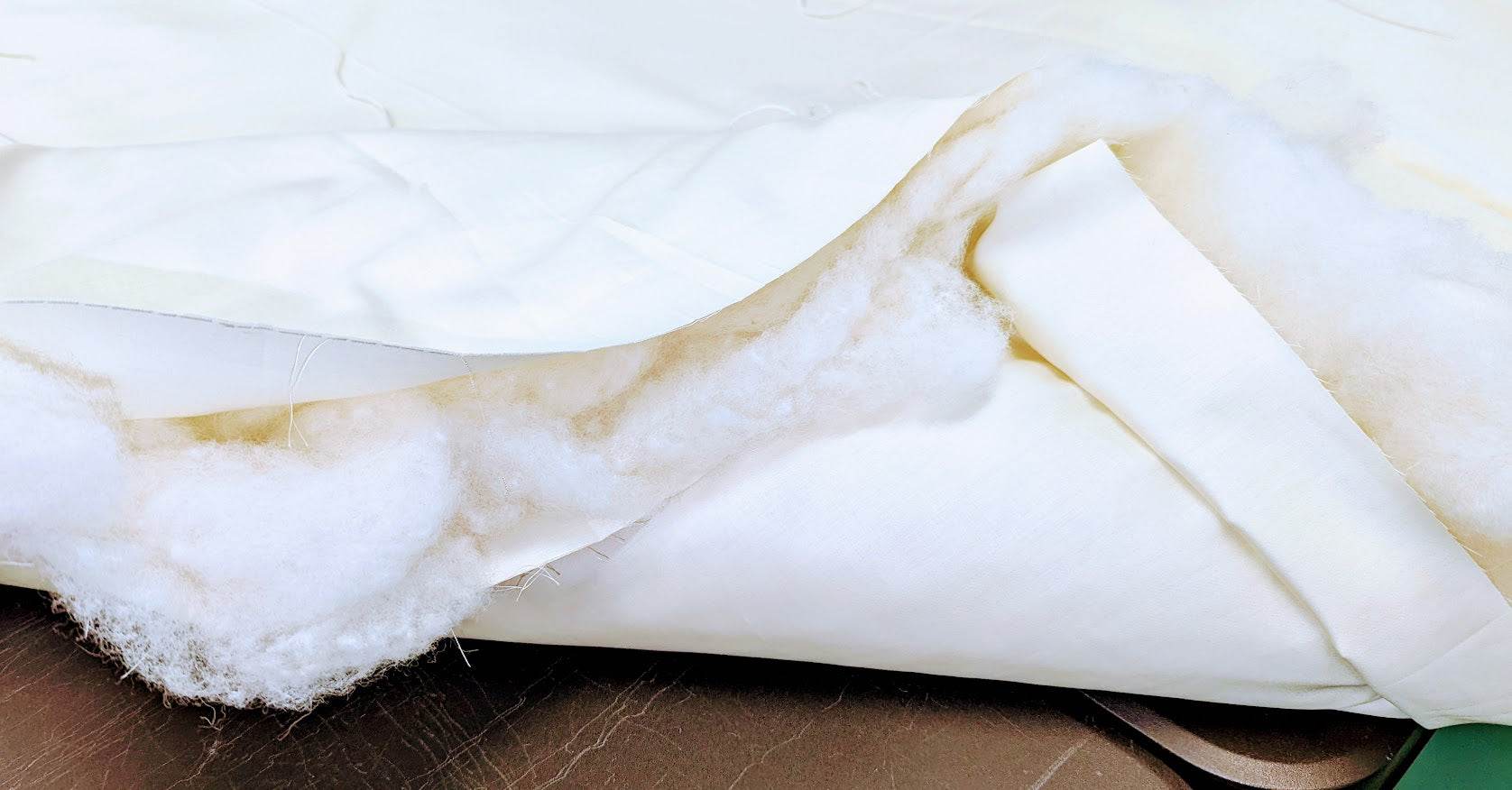 Handmade wool duvet with soft New Zealand wool filling, showcasing luxurious and eco-friendly bedding.