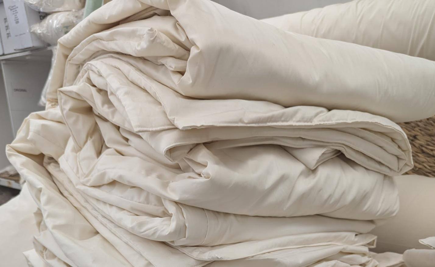 Handmade organic cotton duvet, soft and eco-friendly, folded neatly.