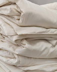 Folded washable wool duvet made from fine merino wool for comfort and longevity.