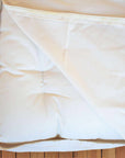 Organic cotton waterproof mattress protector zipper detail showing natural fabric texture