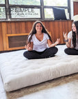 GOTS Certified Organic Cotton and Wool Futon Mattress in a cozy room setting.