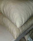 Stack of shredded latex pillows on a shelf showcasing comfort and support.