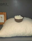 Shredded latex pillow with a bowl of shredded latex, eco-friendly and supportive pillow display.