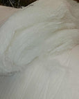Virgin sheep's wool batting, undyed and untreated, perfect for pillows and insulation.