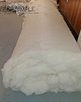 Wool batting roll made from 100% virgin sheep's wool, un-dyed and untreated, ideal for pillows, duvets, and cushions.