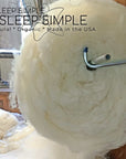 100% virgin sheep's wool batting roll, ideal for insulation in pillows, duvets, and mattresses; naturally antimicrobial and dust-mite resistant.