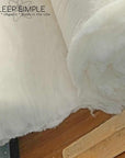Virgin wool batting roll for insulation and quilting use.