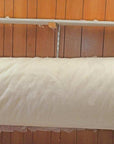 Wool batting roll made from 100% virgin sheep's wool, ideal for insulation and bedding.