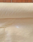 Wool batting roll, 100% virgin sheep's wool, natural and untreated, ideal for bedding and insulation.
