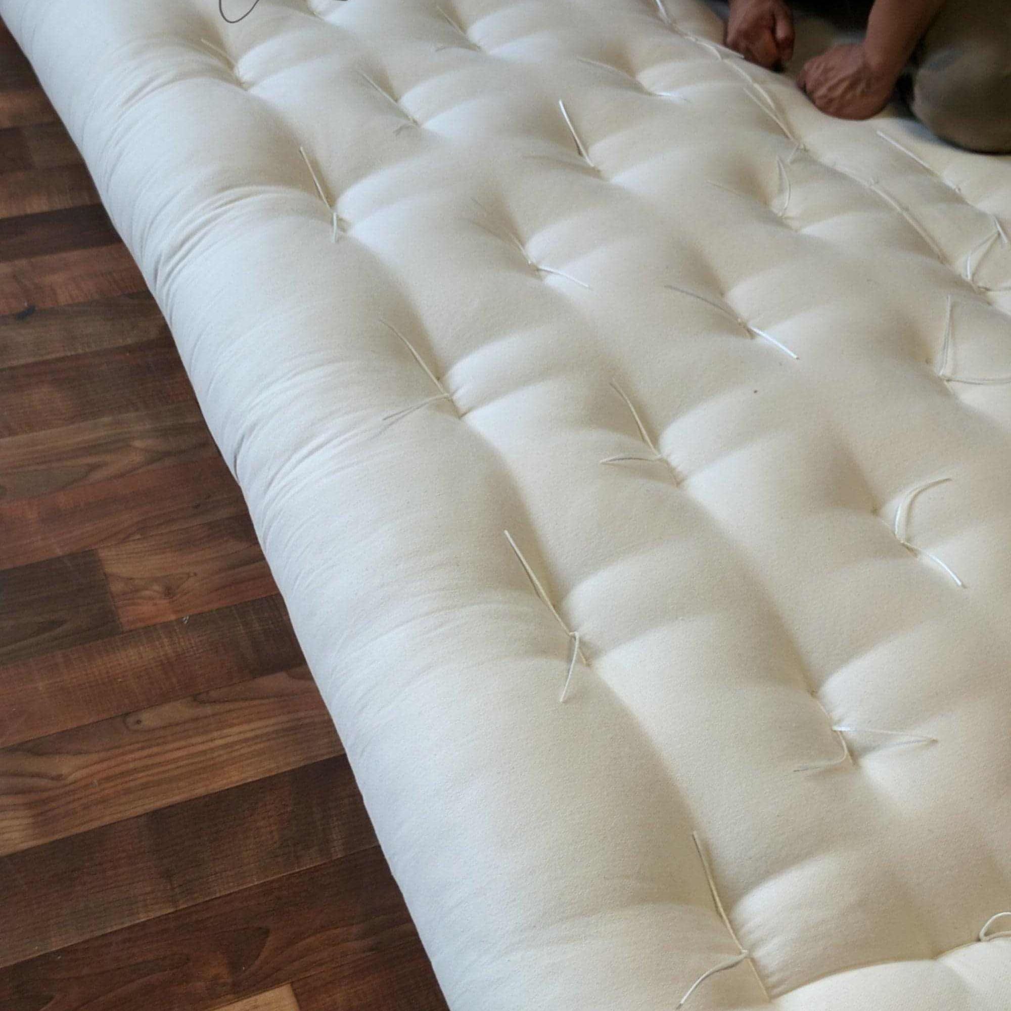 FIRM Cotton and Wool Futon MattressThis mattress is considered to be very firm in feel and is hand-made using 100% cotton batting layers and wrapped with wool! Enjoy the breathability of sleeping on tMattressesWool Futon Mattress