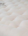 Firm organic cotton and wool futon mattress, GOTS certified, handcrafted, natural fibers, eco-friendly bedding.