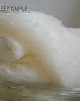 GOTS certified organic wool batting, traceable carded wool, eco-friendly, hypoallergenic, temperature-regulating.