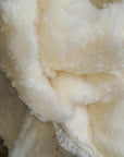 Organic wool batting made from GOTS certified, ethically sourced virgin wool, naturally antimicrobial and hypoallergenic, perfect for sustainable crafting.