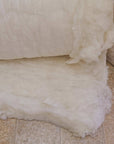 Organic wool batting roll for crafting and insulation projects.