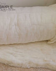 Organic wool batting roll, GOTS certified, made from natural, ethically sourced New Zealand sheep wool, eco-friendly and hypoallergenic.