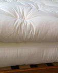 Organic cotton mattress topper, handmade in USA, plush and breathable, chemical-free.