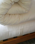 Organic cotton mattress topper, handmade in USA, plush and natural comfort.