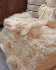 Kapok Fiber bundle for natural pillow and cushion filling; eco-friendly, plant-based, hypoallergenic material.