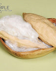 Natural kapok fiber in seed pods, eco-friendly alternative for pillows and cushions.