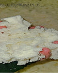 Natural Shredded Latex Fill, shown in hand. Ideal for pillows, cushions & beanbags, made in the USA.