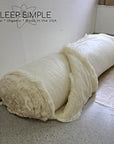 GOTS certified organic wool batting roll with natural and chemical-free properties, made from ethically sourced wool from New Zealand sheep.