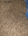 Buckwheat hulls in bulk container, grown in the US, suitable for pillows and cushions.
