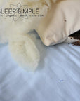 Buckwheat and wool pillow with organic materials showing buckwheat hulls and wool filling.