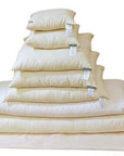 Stack of Best Kapok Pillow in various sizes, showcasing soft, eco-friendly comfort and support.