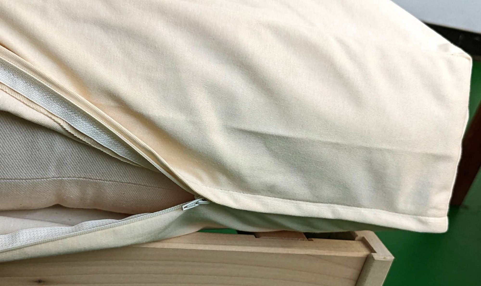 Organic cotton waterproof mattress protector top view showing clean natural fabric
