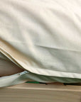 Organic cotton waterproof mattress protector top view showing clean natural fabric