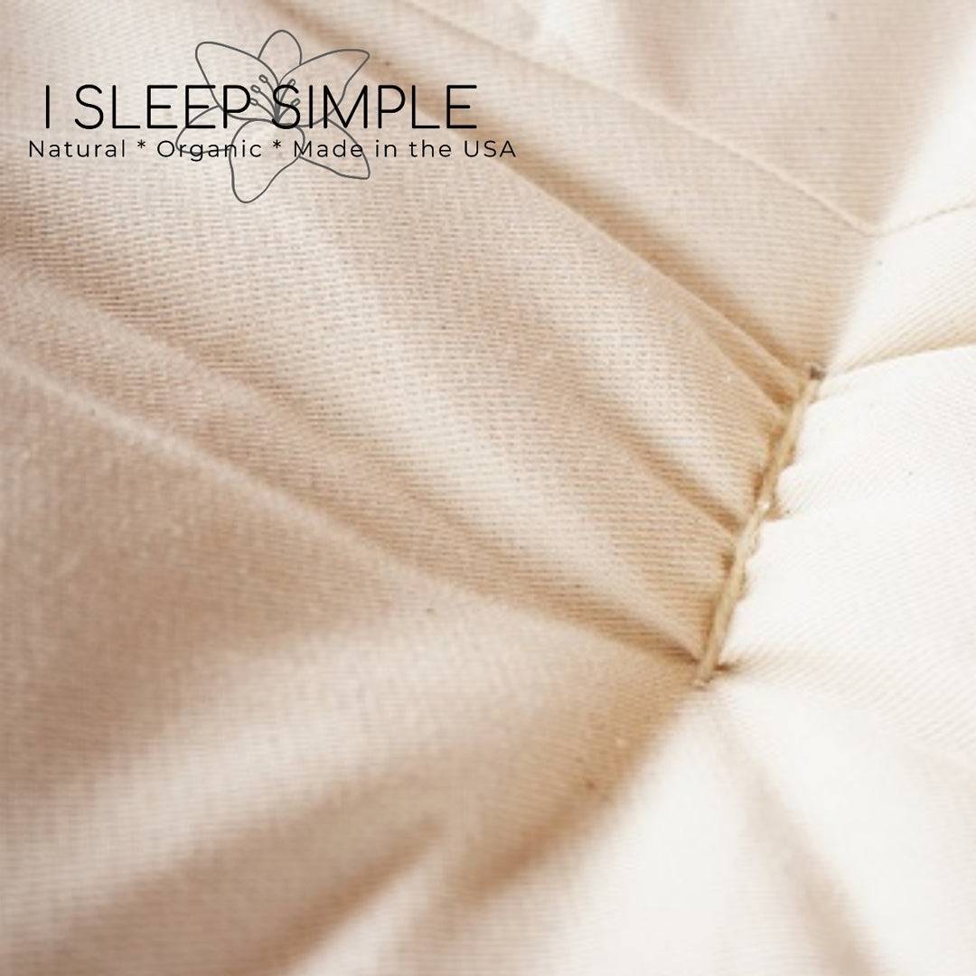 Close-up view of a GOTS certified organic cotton and wool futon mattress surface, showcasing its natural texture and handcrafted quality.