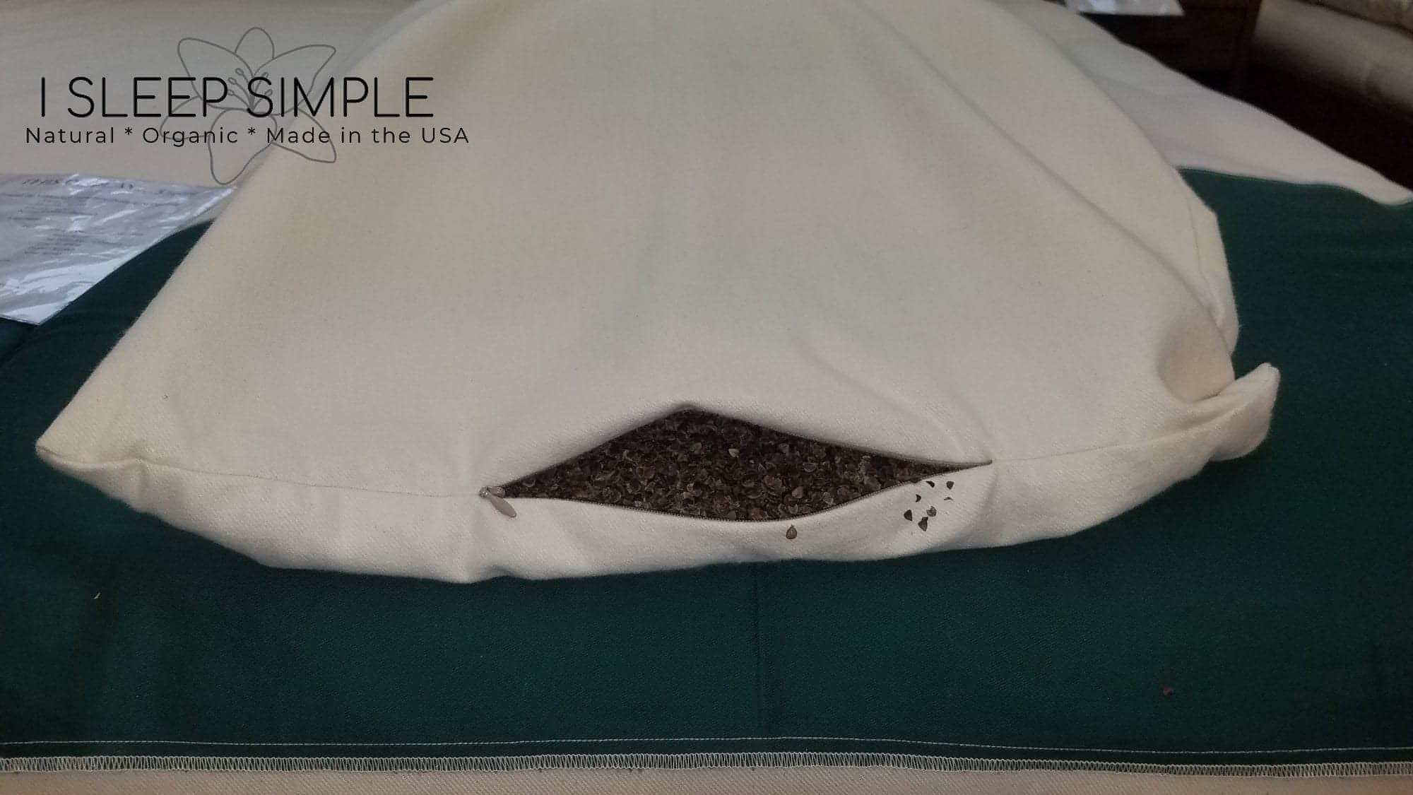 Buckwheat pillow with organic fill and adjustable design for comfort and support.