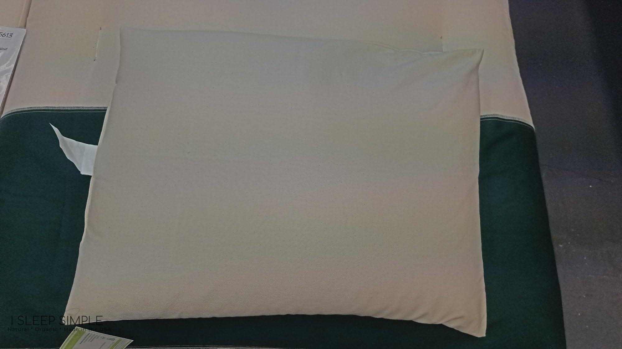 Buckwheat pillow on a bed, offering ergonomic support and natural comfort for better sleep.