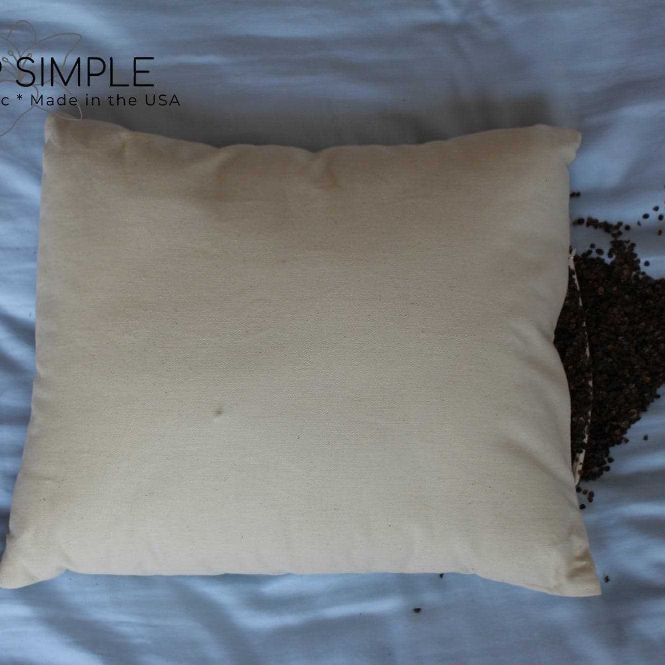 Buckwheat Pillow with organic filling on a bed, promoting natural comfort and support.