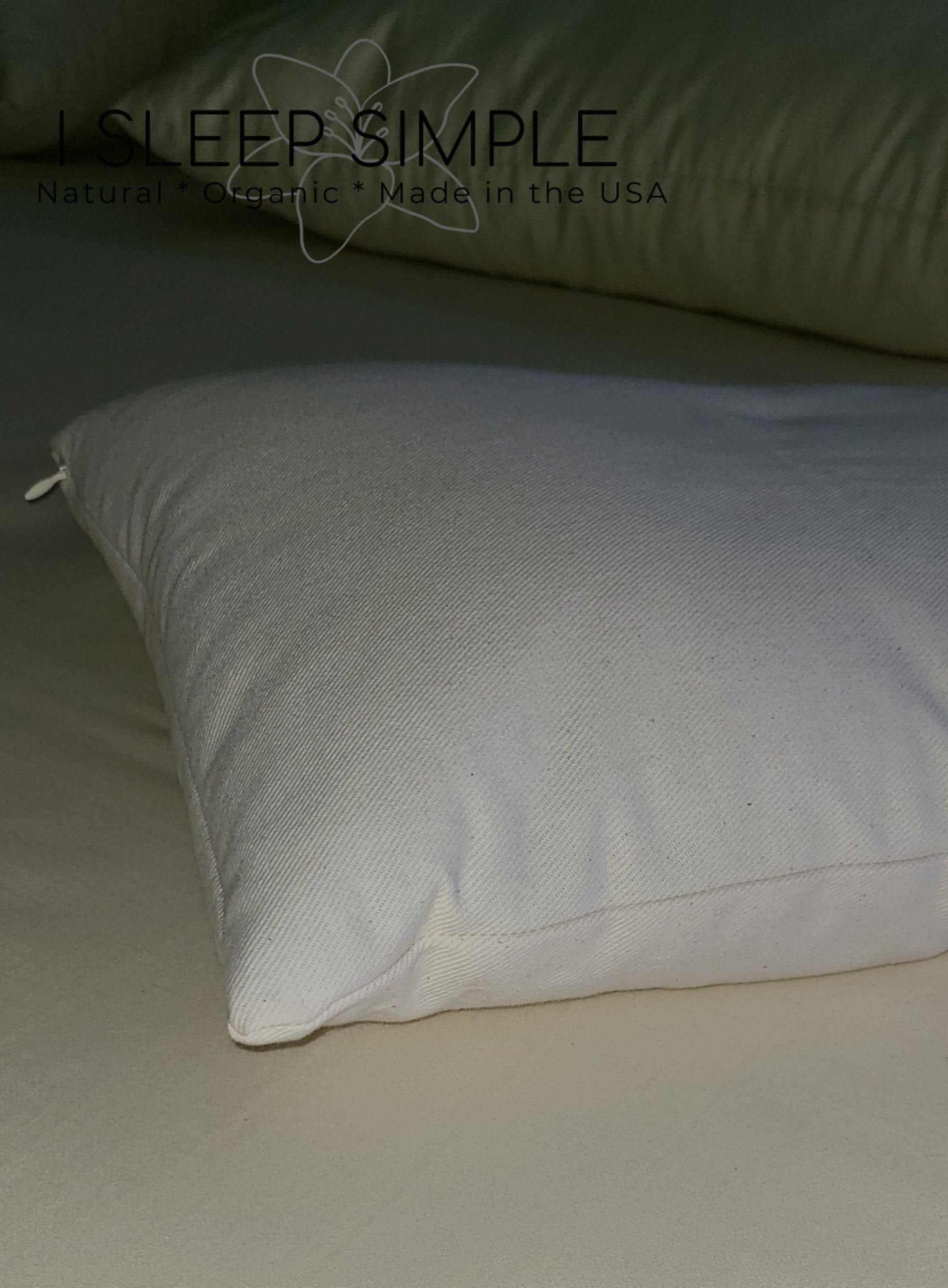 Buckwheat and wool pillow on a bed, showcasing natural, organic materials for supportive and luxurious sleep.