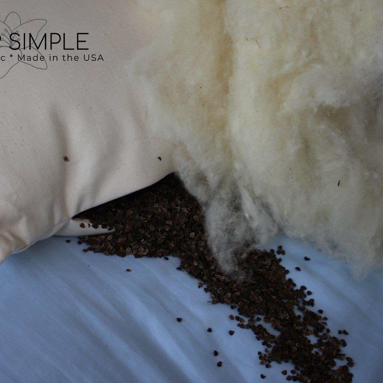 Buckwheat and wool pillow with natural organic fill on a blue background.