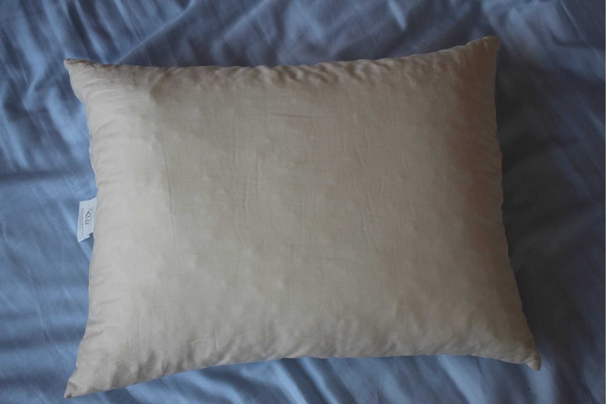 Shredded Latex Pillow on a blue sheet, providing breathable and supportive comfort.