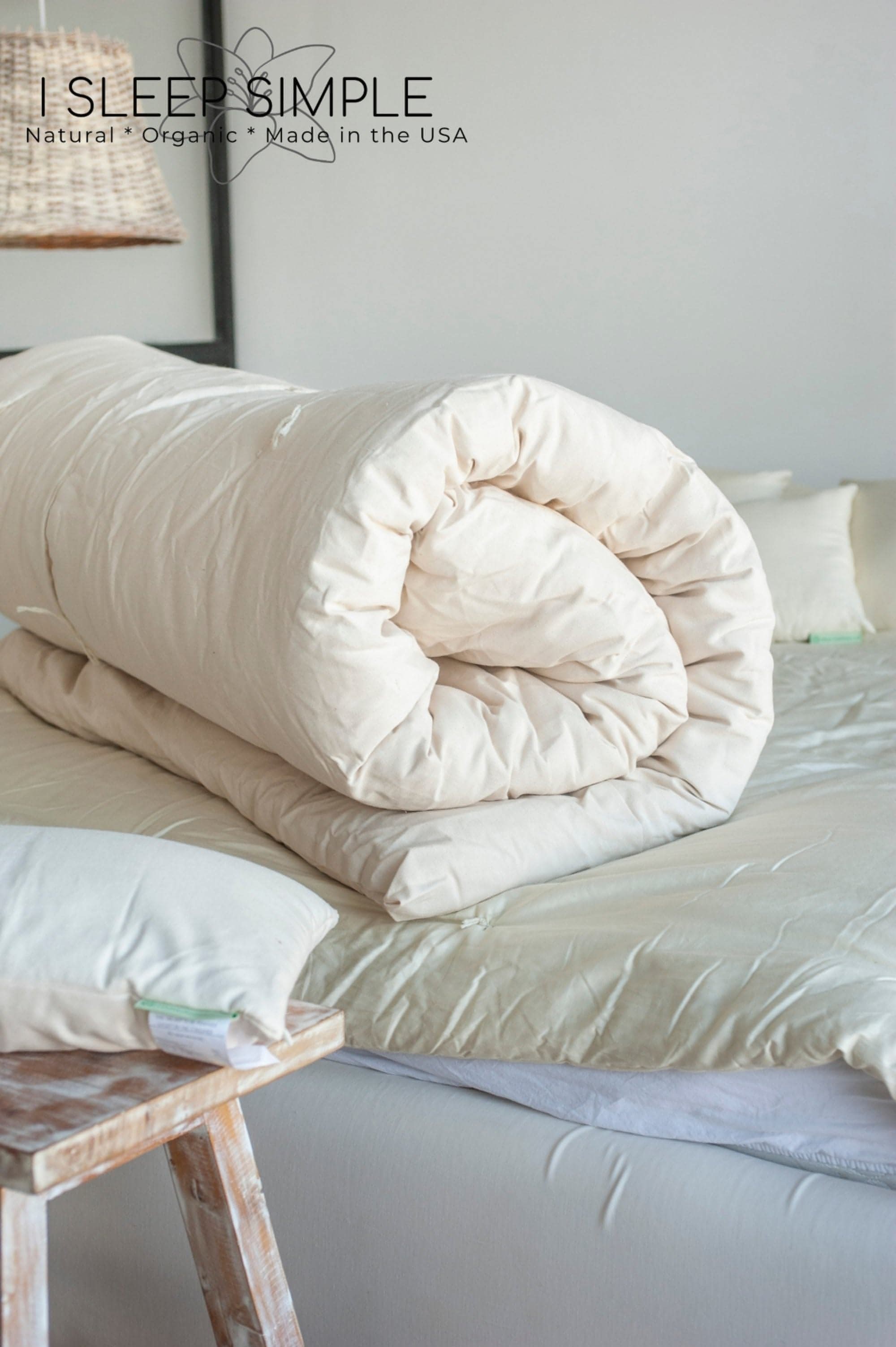 Cotton Mattress Topper rolled on bed, offering plush comfort and breathability.