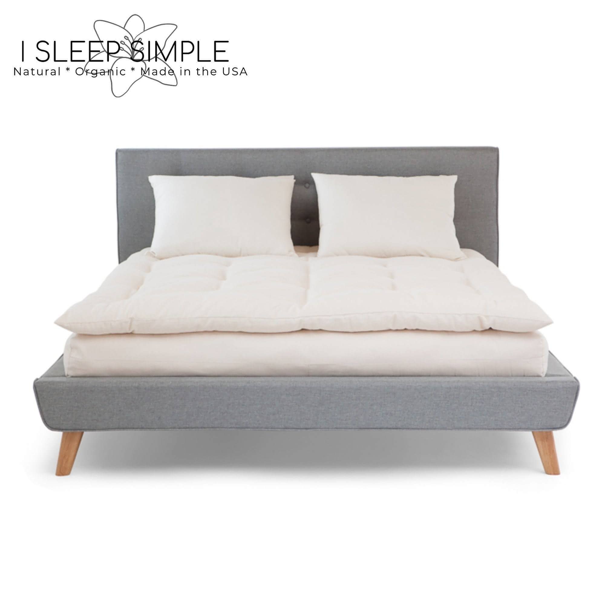 Cotton Mattress Topper on a bed, offering plush, breathable comfort with organic materials, handmade in the USA.