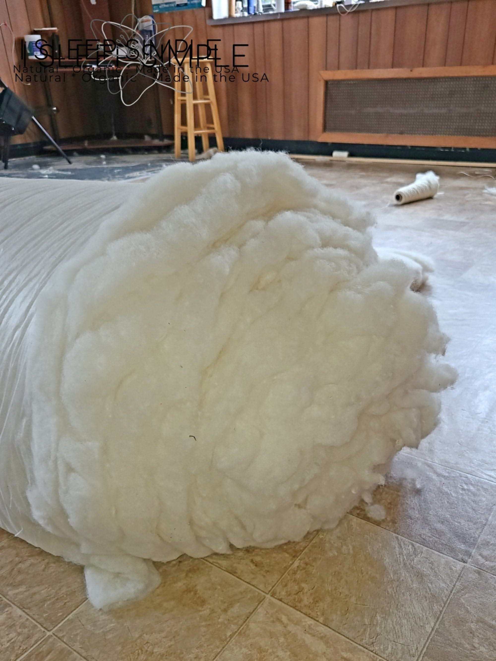 100% virgin wool batting roll, untreated and un-dyed, ideal for insulation, quilting, and more.