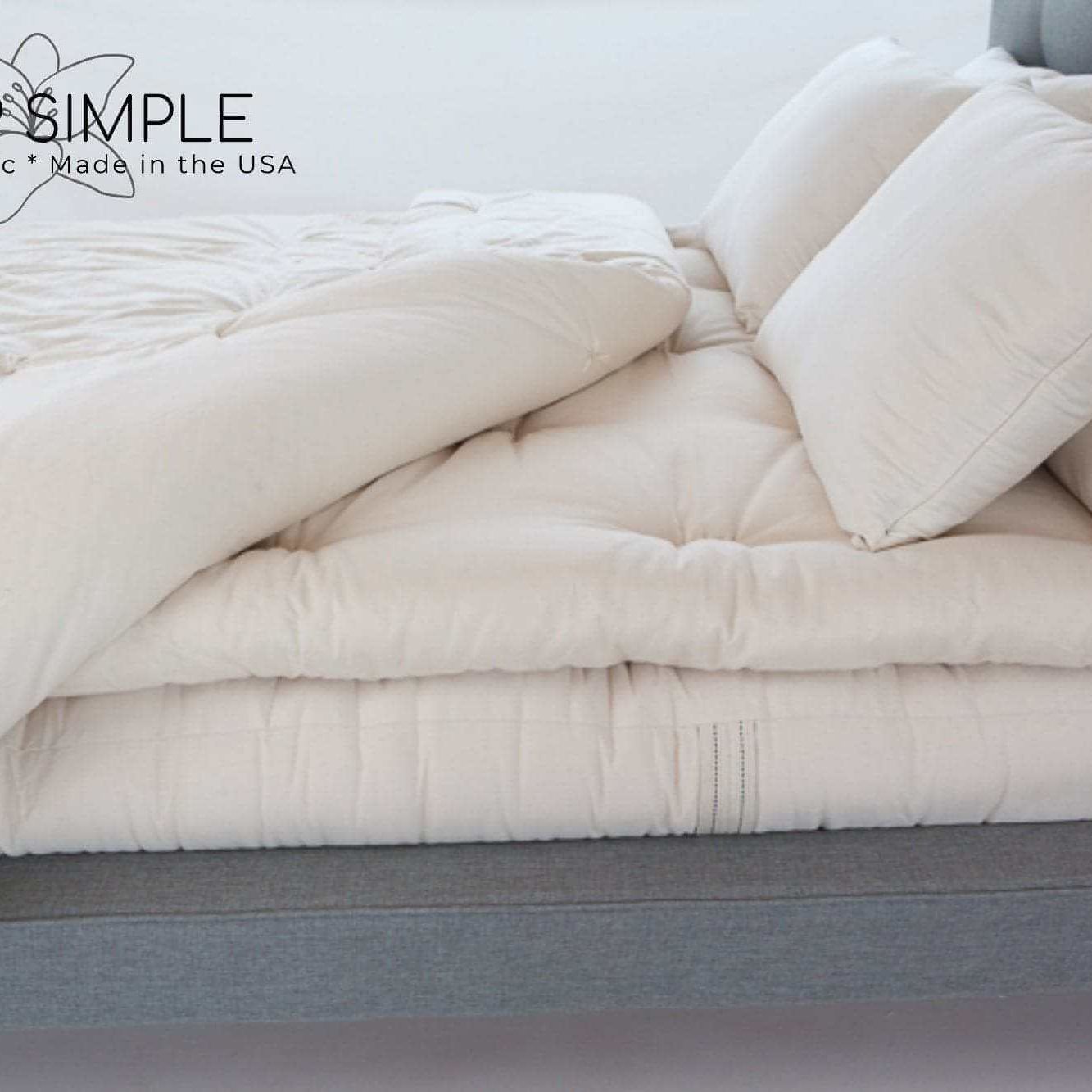 Wool Mattress Topper on a bed, offering natural comfort and support.