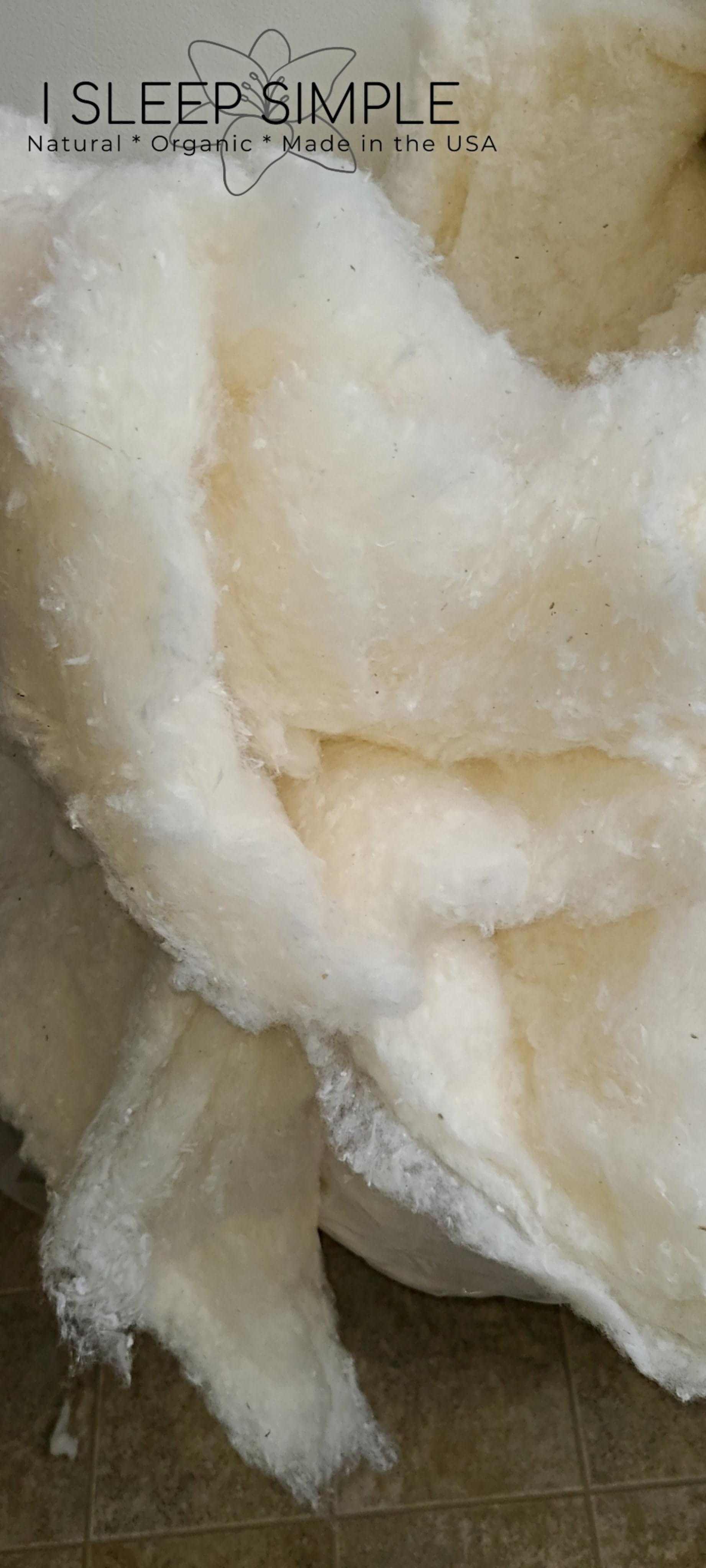 Organic wool batting made from GOTS certified, ethically sourced virgin wool, naturally antimicrobial and hypoallergenic, perfect for sustainable crafting.