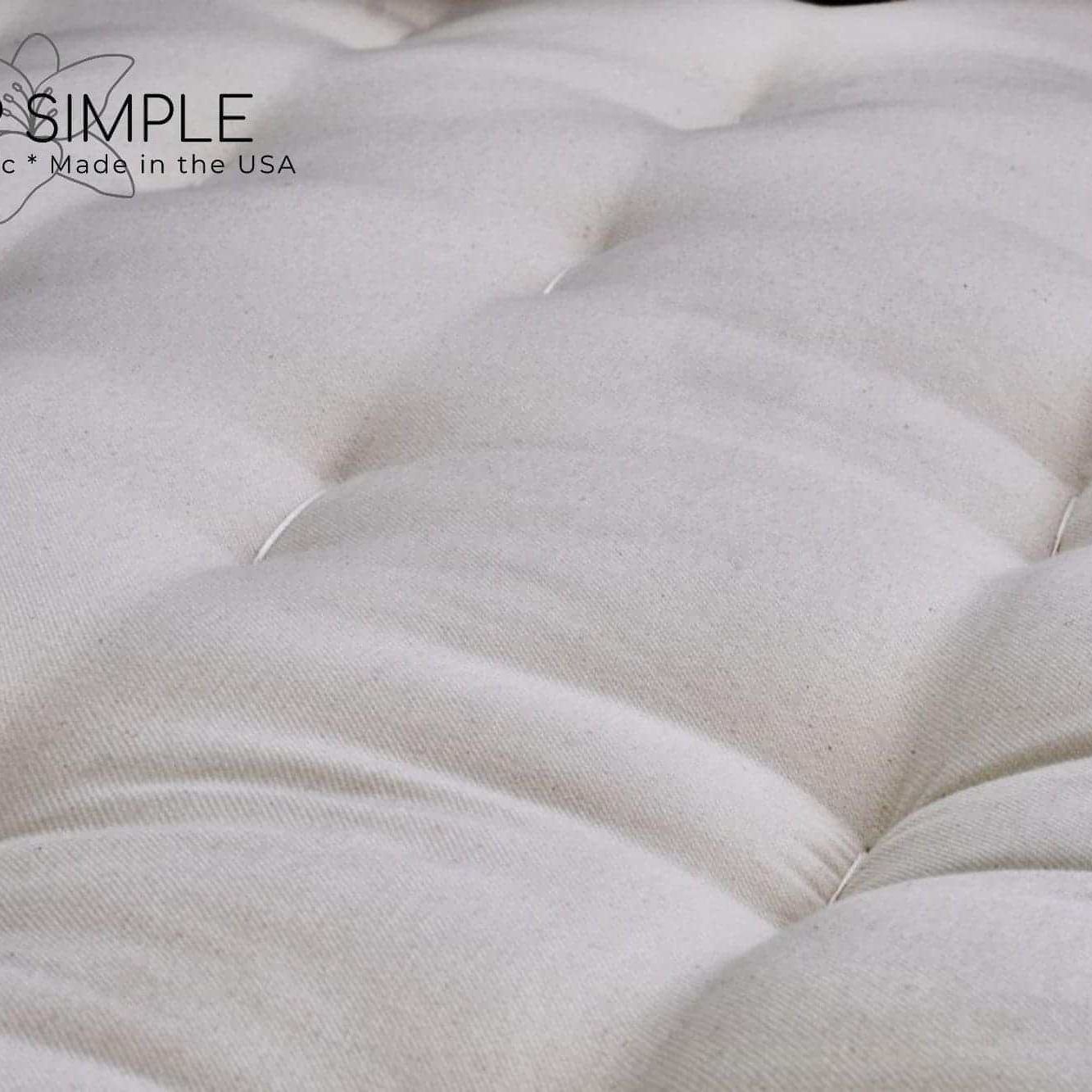 Close-up view of the GOTS Certified Organic Cotton and Wool Futon Mattress, showcasing the natural twill fabric texture.