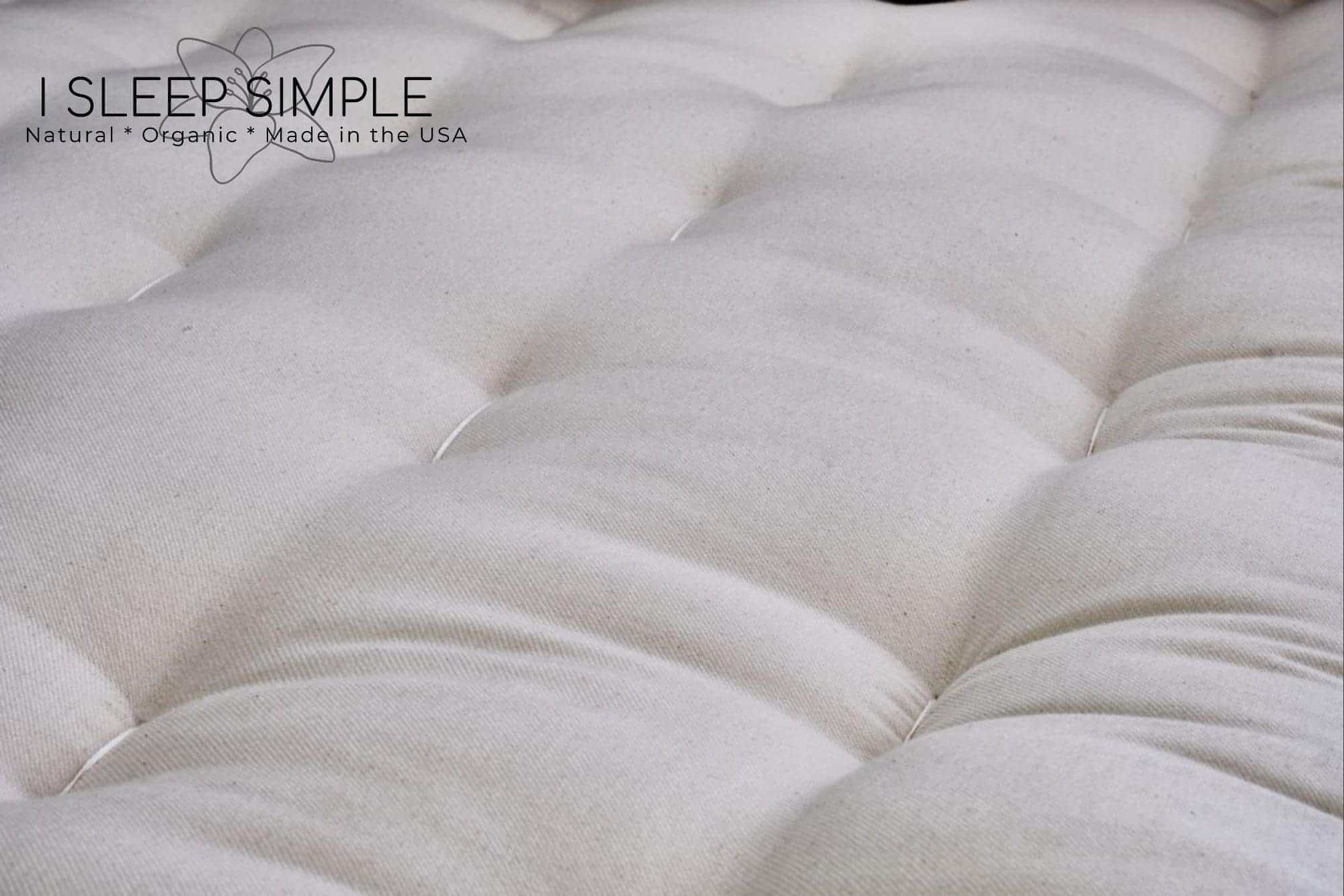 Close-up view of the GOTS Certified Organic Cotton and Wool Futon Mattress, showcasing the natural twill fabric texture.